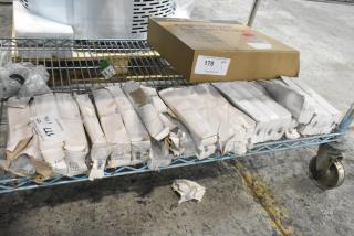 Boxes of 12 Walco Royal Bristol dessert spoons, 18/0 stainless steel, heavy weight, scratch and dent condition, on a metal cart.