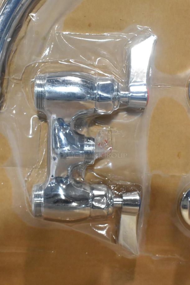 Chrome faucet with handles in packaging, labeled "Brand New Scratch and Dent," showing minor surface flaws.