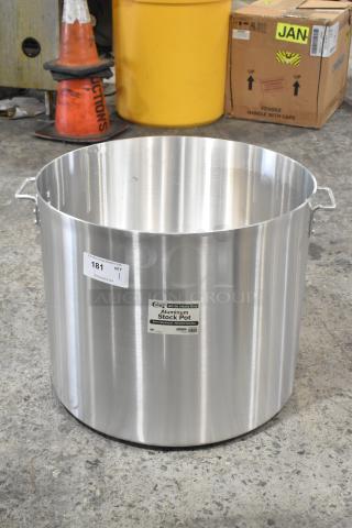 Brand new heavy-duty Choice 140 Qt. aluminum stock pot, metal handles, minor scratches, and dents, labeled for auctions.