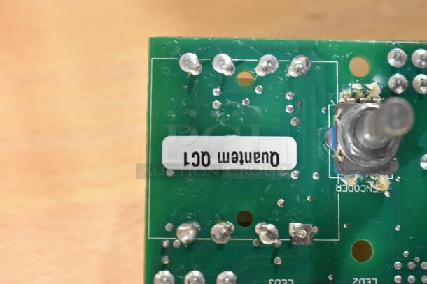 Close-up view of a circuit board with a knob and label reading "Quantum OCI," from HP2HT689 Perfect Fry Motor Assembly.