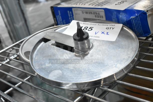 Robot Coupe food processor blades, models J6x6 and E8 S5/16, on metal shelf, good condition, includes label with auction details.