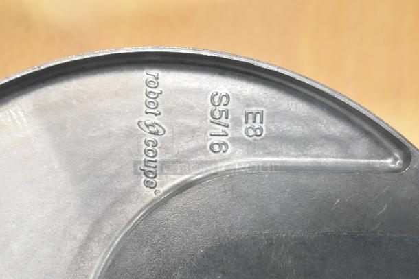 Robot Coupe food processor blade, model E8 S5/16, metallic finish, marked with brand and model for identification.