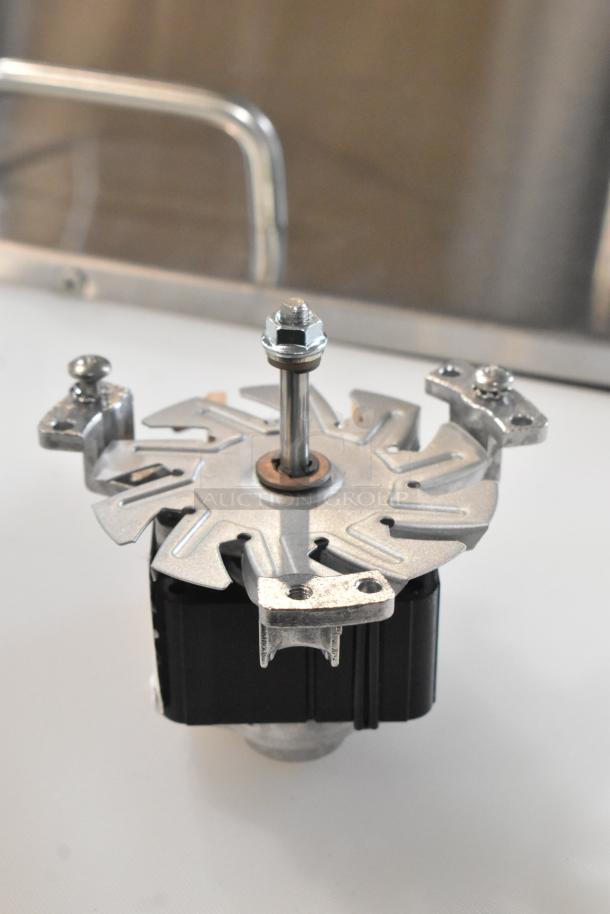 Brand new Blickman R61-120H3 fan motor, silver and black, with scratch and dent marks, includes mounting hardware.