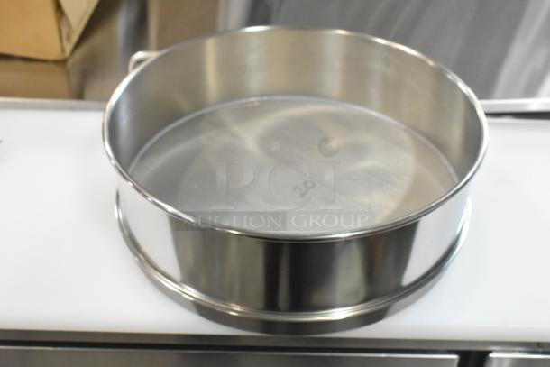 Alt text: Grainger FH-SS-SS-US #20 sieve, stainless steel, new condition, minor scratch and dent, mesh marked "20".