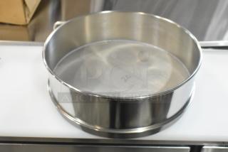 Alt text: Grainger FH-SS-SS-US #20 sieve, stainless steel, new condition, minor scratch and dent, mesh marked "20".