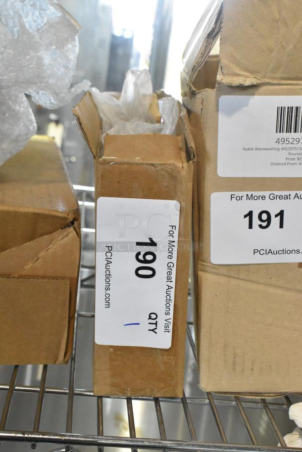 Cardboard box with item tag, "Hatco AP63-20034F25 Black Legs," new but marked as "Scratch and Dent," on a metal shelf.