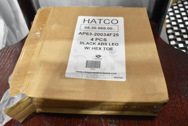 Brown package labeled "HATCO AP63-20034F25 Black ABS Leg w/ Hex Toe," containing 4 pieces. Condition: New, slight exterior damage.