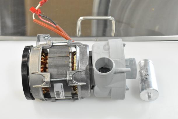 Brand new Noble Warewashing 4952975138 wash pump for LT-UC24, scratch and dent. Serial number visible on label.
