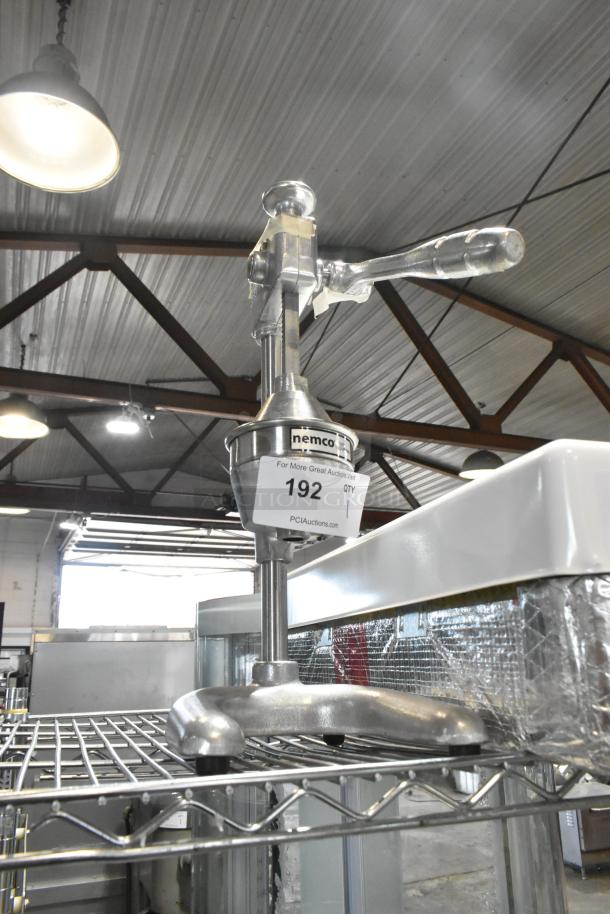 Brand new Nemco 55850 manual citrus juicer, heavy-duty, with minor dents. Auction tag shows item number 192.