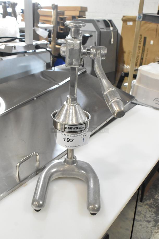 BRAND NEW Nemco 55850 manual heavy-duty citrus juicer, silver, scratch and dent condition, labeled "192" for auction.