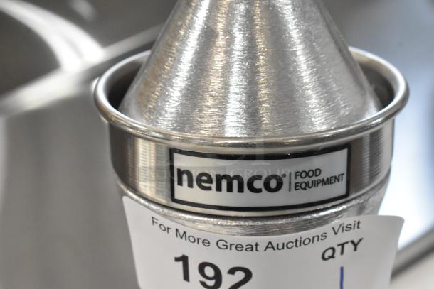 Brand new Nemco 55850 heavy-duty citrus juicer, scratch and dent condition, stainless steel, with visible branding.