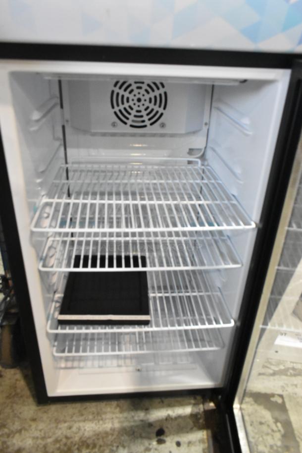 Brand new Avantco 360SC80 mini cooler merchandiser, metal, 110-120 volts, 1 phase. Interior shelves visible, slight dents.