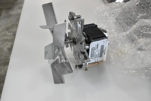 Brand new Blickman FM-8011 fan motor with minor scratches and dents, label shows model and serial number.