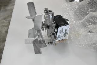 Brand new Blickman FM-8011 fan motor with minor scratches and dents, label shows model and serial number.