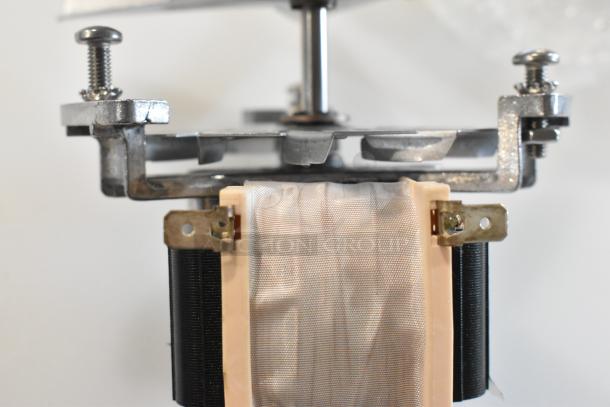 Brand new 2025 Blickman FM-8011 fan motor, visible scratch and dent, metal frame, plastic housing, electrical connectors.