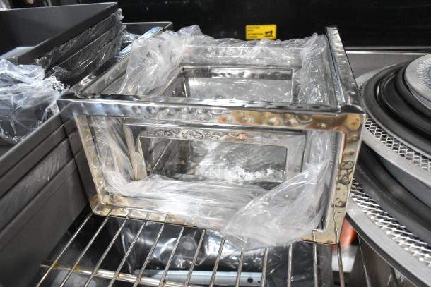 10 scratch and dent items: American Metalcraft, pans, metal riser, mix of 10, new with imperfections, packaged on shelf.