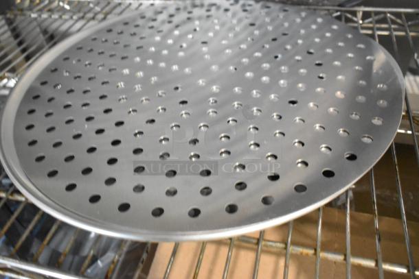 Round perforated baking sheet, metal, scratch and dent, new. Ideal for airflow, baking. Includes metal mesh pans.
