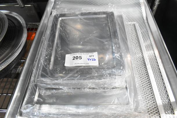 Stack of 22 brand new American Metalcraft deep dish pizza pan separators, wrapped in plastic with auction label.