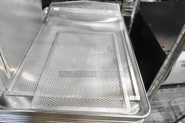 Brand new metal baking pans including American Metalcraft DSP11 deep dish pizza pan separator, shown as scratch and dent items.