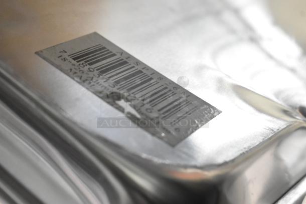 22 scratch and dent metal pans, including American Metalcraft DSP11 and ALSP1826M models, featuring barcodes.