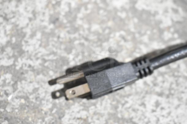 Close-up of a power plug for the Carnival King 382CDF17A corn dog fryer, emphasizing its 120V compatibility.