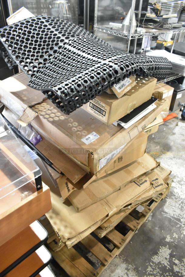 14 new scratch and dent items on pallet, including anti-fatigue mat and storage drawer, with visible product labels.