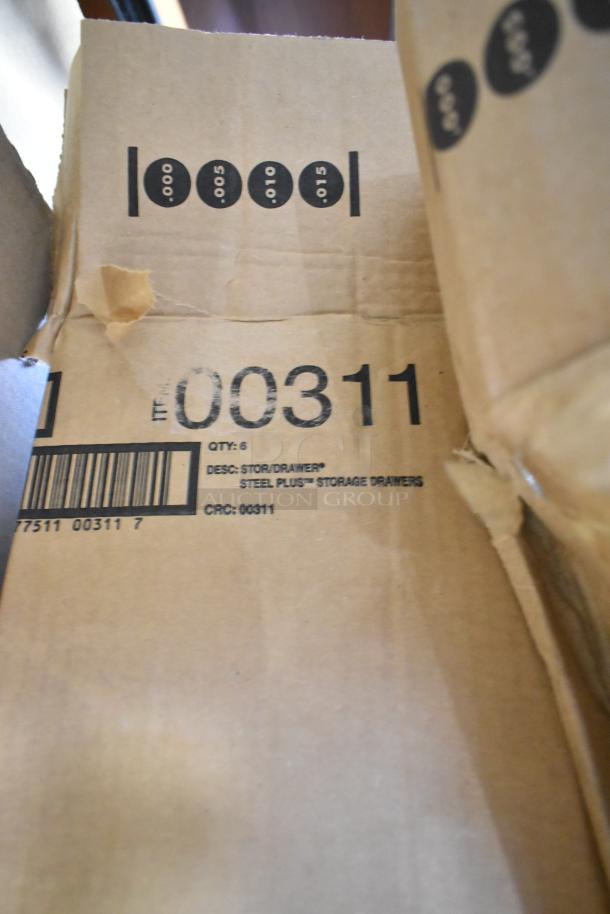 Cardboard box with label "00311 Storage Drawer" indicating Steel Plus storage drawers quantity six per box.