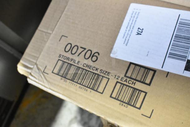Cardboard box labeled "00706," containing scratch and dent items such as an anti-fatigue floor mat, needle rib, storage drawer, and dispenser.