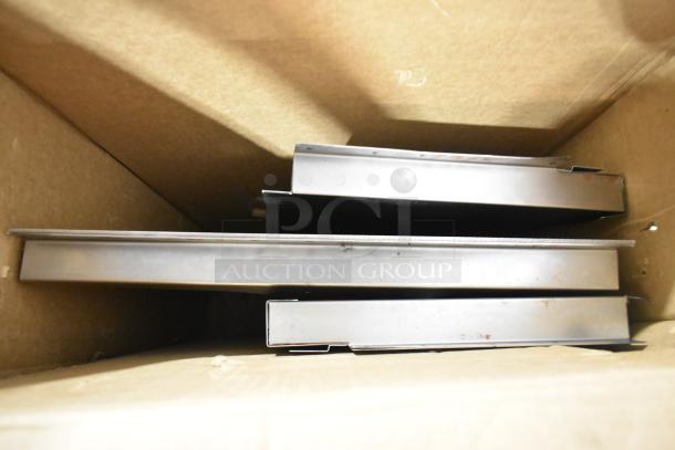 Metal vent pieces in a box, "Brand New Scratch and Dent!" condition, Blodgett brand, slight scratches visible.