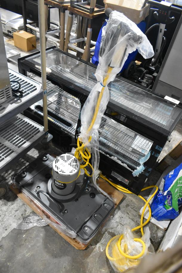 Brand new Lavex SP-2805 floor cleaning machine, 120 volts, 1 phase. Visible scratches and dents, wrapped in plastic.
