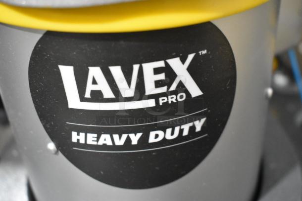 BRAND NEW Lavex SP-2805 floor cleaning machine, 120V, 1 phase. Heavy duty with minor cosmetic scratches, logo visible.