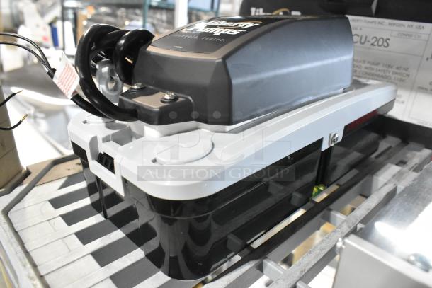 Brand new Liberty Pumps LCU-20S automatic condensate pump, 3/8" size with safety switch, 1/9 hp, 115V. Includes visible tags.