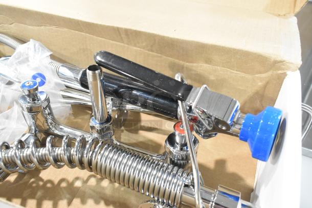 BRAND NEW Fisher 34450 pre-rinse faucet in box, featuring 12" wall bracket, 16" riser, 10" swing nozzle, 36" hose.
