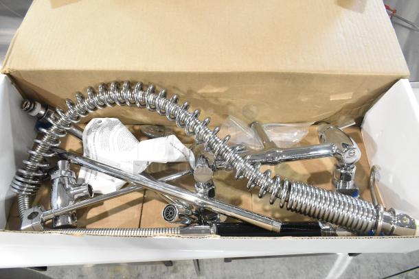 Brand new Fisher 34034390 wall-mount pre-rinse faucet set with 12" wall bracket, 16" riser, 12" swing nozzle, 36" hose.