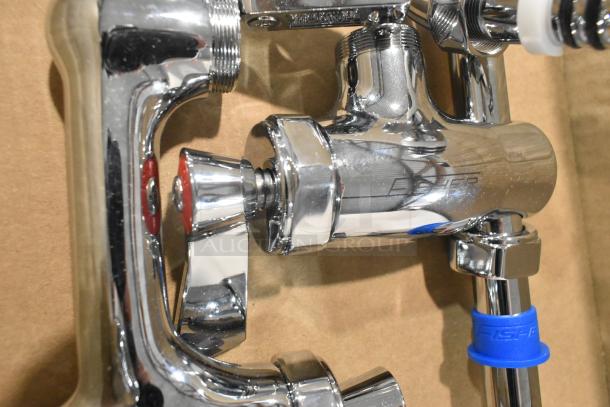 Brand new Fisher 34034410 backsplash-mount pre-rinse faucet with scratch and dent. Features 12" wall bracket, 16" riser, 12" swing nozzle, 36" hose.