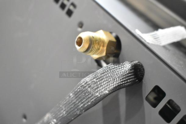 "Close-up of a connection detail on a Bromic Heating BH0210003 Tungsten Smart-Heat 500 Series Natural Gas Patio Heater."