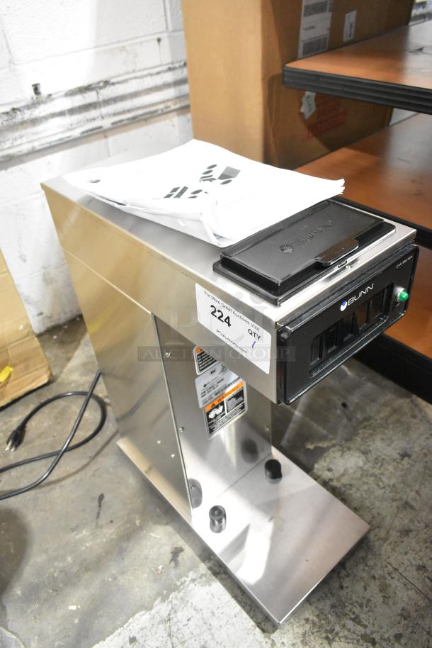 Stainless steel 2022 Bunn CW15-APS coffee brewer, new scratch and dent, 120V, 1 phase, tags and user manual visible.