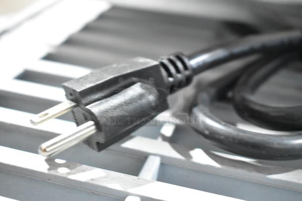 Close-up of power cord for Avantco 177CPO16TSGL countertop pizza oven. Oven is new with broken glass door. 120V, 1 phase.