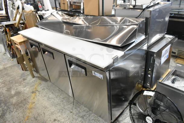 Brand new Avantco 178APT71HC stainless steel commercial sandwich salad prep table with minor dents on top, 115V, 1 phase.