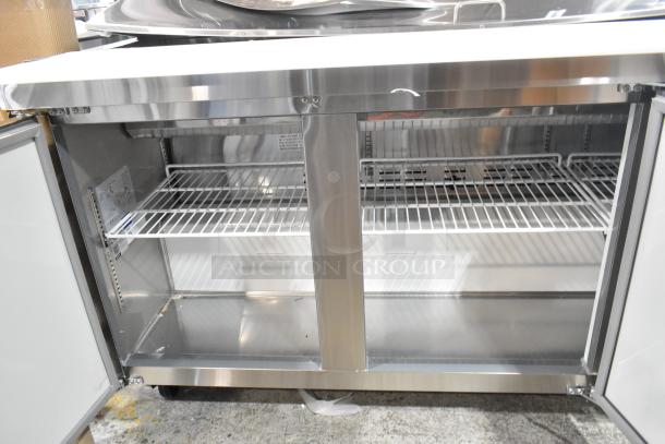 Brand new Avantco 178APT71HC stainless steel sandwich prep table, featuring mega top bain marie, and commercial casters.