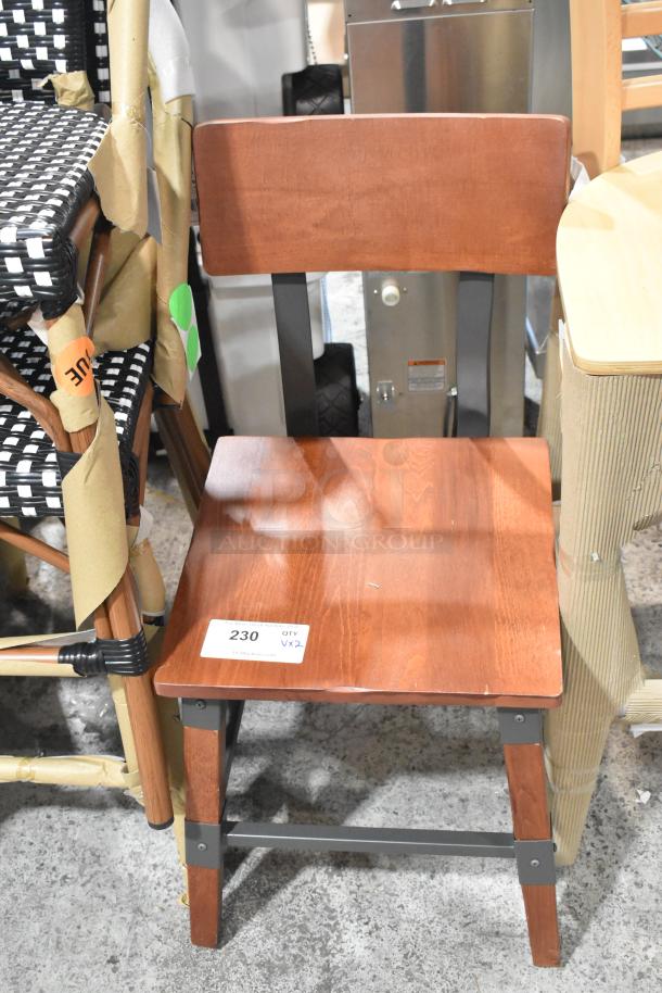 Brand new scratch and dent wooden dining chair, warm brown finish, metal supports, tagged "230 QTY VX2."