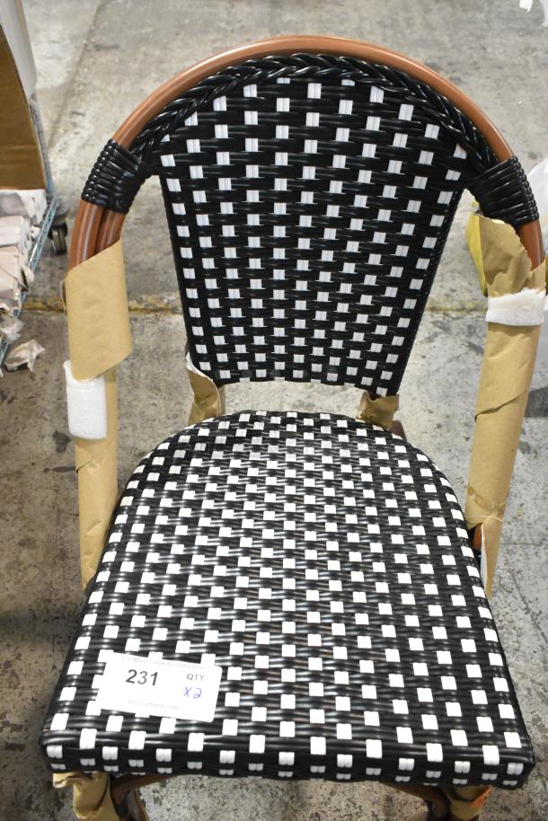 2 Lancaster Bistro stools, black/white checkered rattan, counter height, outdoor use, new condition, minor scratches.
