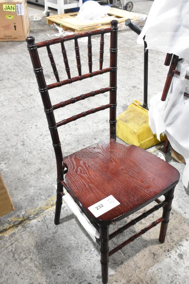 Brand new wood pattern dining height chair, dark finish, with minor scratches. Lot number 232 visible on seat tag.