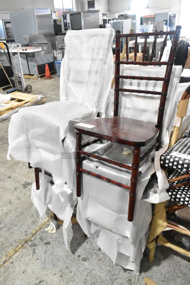 12 new wood pattern dining chairs, wrapped, dining height, sturdy design, labeled scratch and dent, pristine condition.