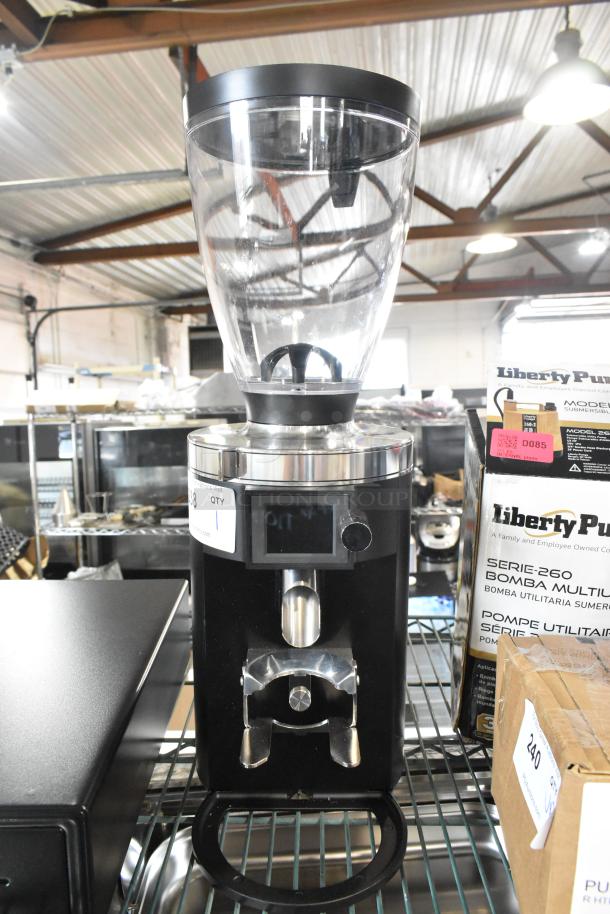 Brand new Mahlkonig E65T espresso grinder, 2.6 lb. capacity, black, 120 volts, 1 phase, with minor scratches.