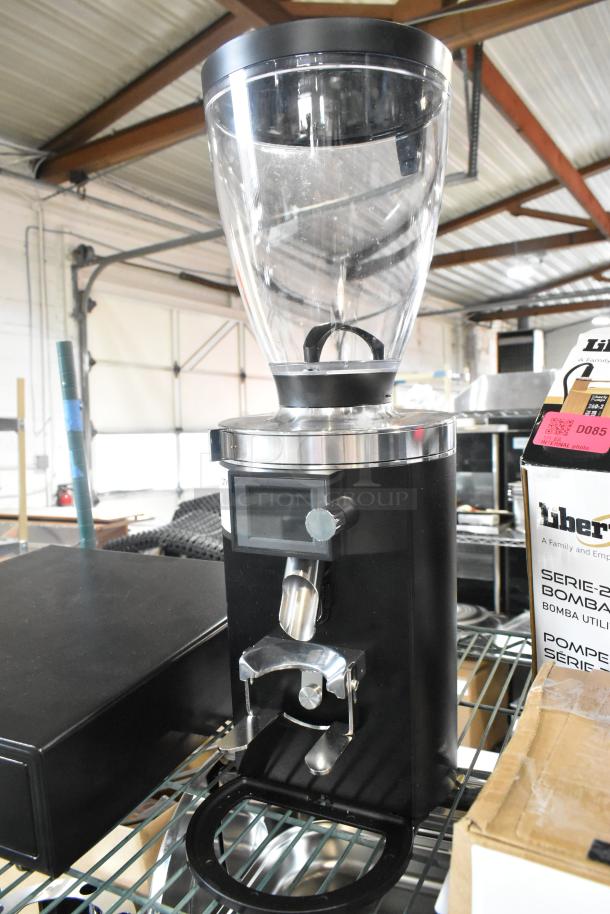 BRAND NEW Mahlkonig E65T black espresso grinder, 2.6 lb capacity, scratch and dent, 120 Volts, 1 Phase, visible digital interface.