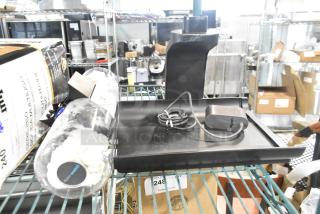 Three brand new scratch and dent items including Dyson WashG1 Base on a metal shelf, with labels and packaging visible.