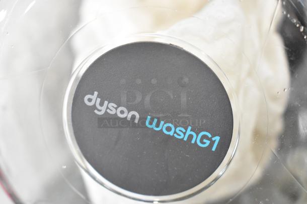 Dyson WashG1 base, brand new, part of three scratch and dent items. Clear lid with Dyson logo visible.