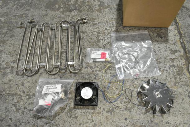 7 new scratch and dent items including Hatco R02.06.004F.00 Element 4000w 208v; various parts, labeled in bags.