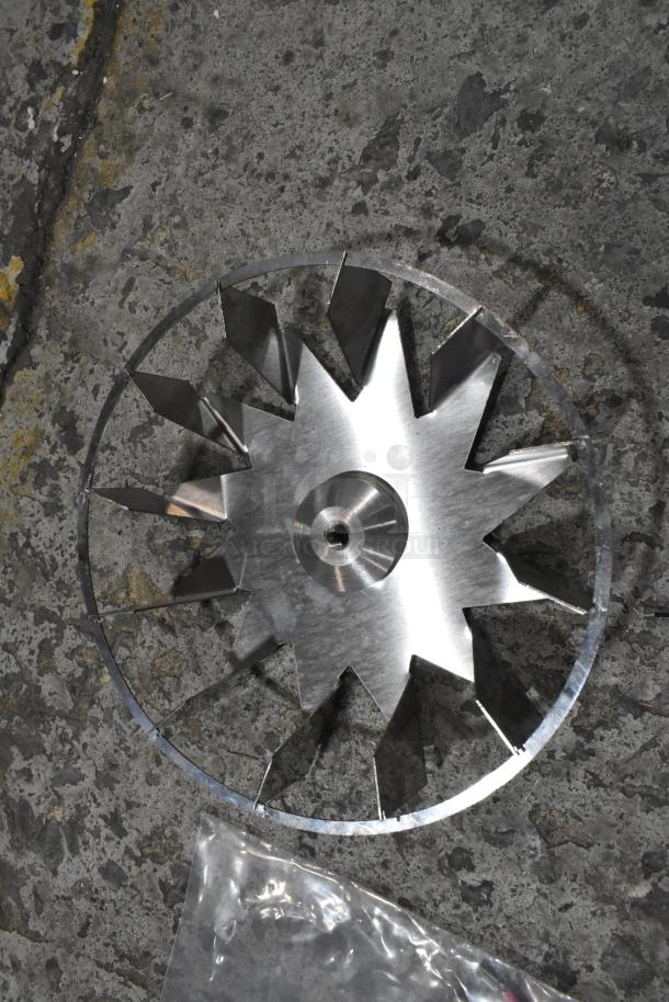 Metal component with angular design, new condition, part of auction lot including Hatco element and other equipment.